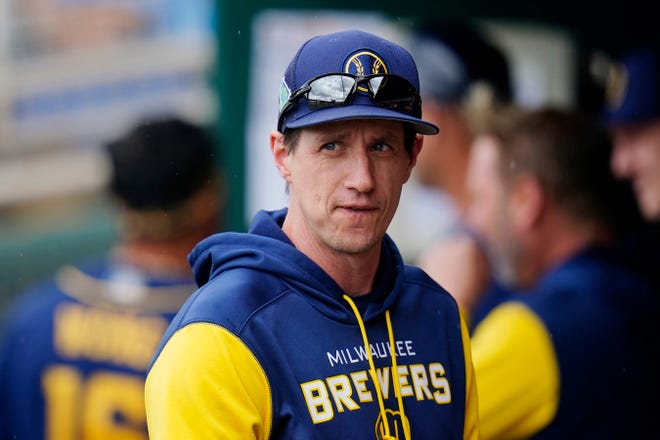Milwaukee Brewers manager Craig Counsell walks through the dugout prior to a spring training baseball game against the Cleveland Guardians Tuesday, March 29, 2022, in Goodyear, Ariz. (AP Photo/Ross D. Franklin) ORG XMIT: RFOTK