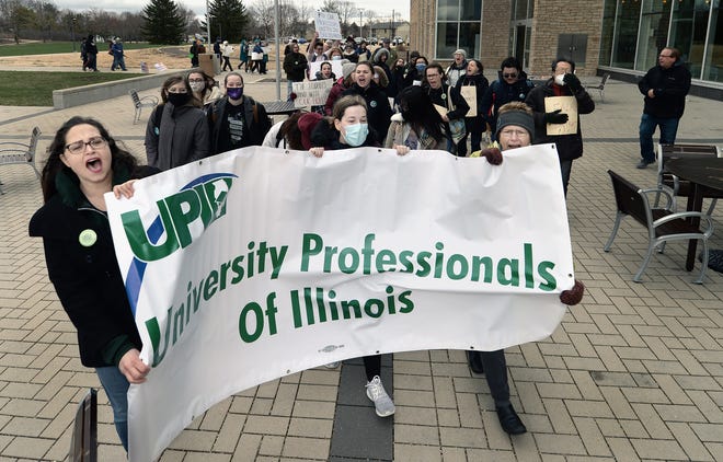 University of Illinois Springfield faculty and students participate in a rally on campus held by the UIS United Faculty on Thursday. University faculty have been working without a contract since Aug. 16. Bargaining between the union and administration resumes Friday.