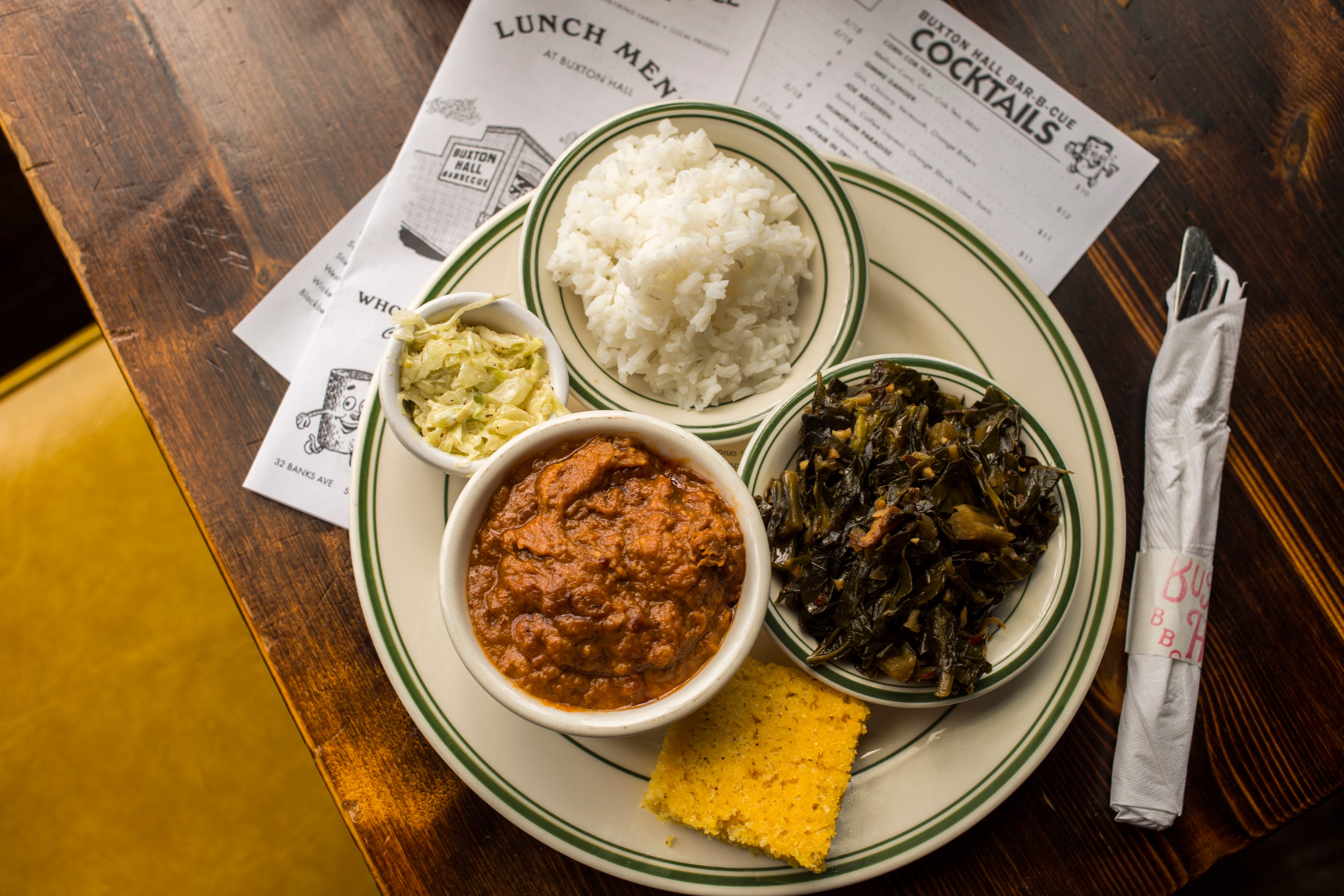A slew of Southern sides at Buxton Hall Barbecue, including South Carolina-style barbecue hash, rice and collard greens.