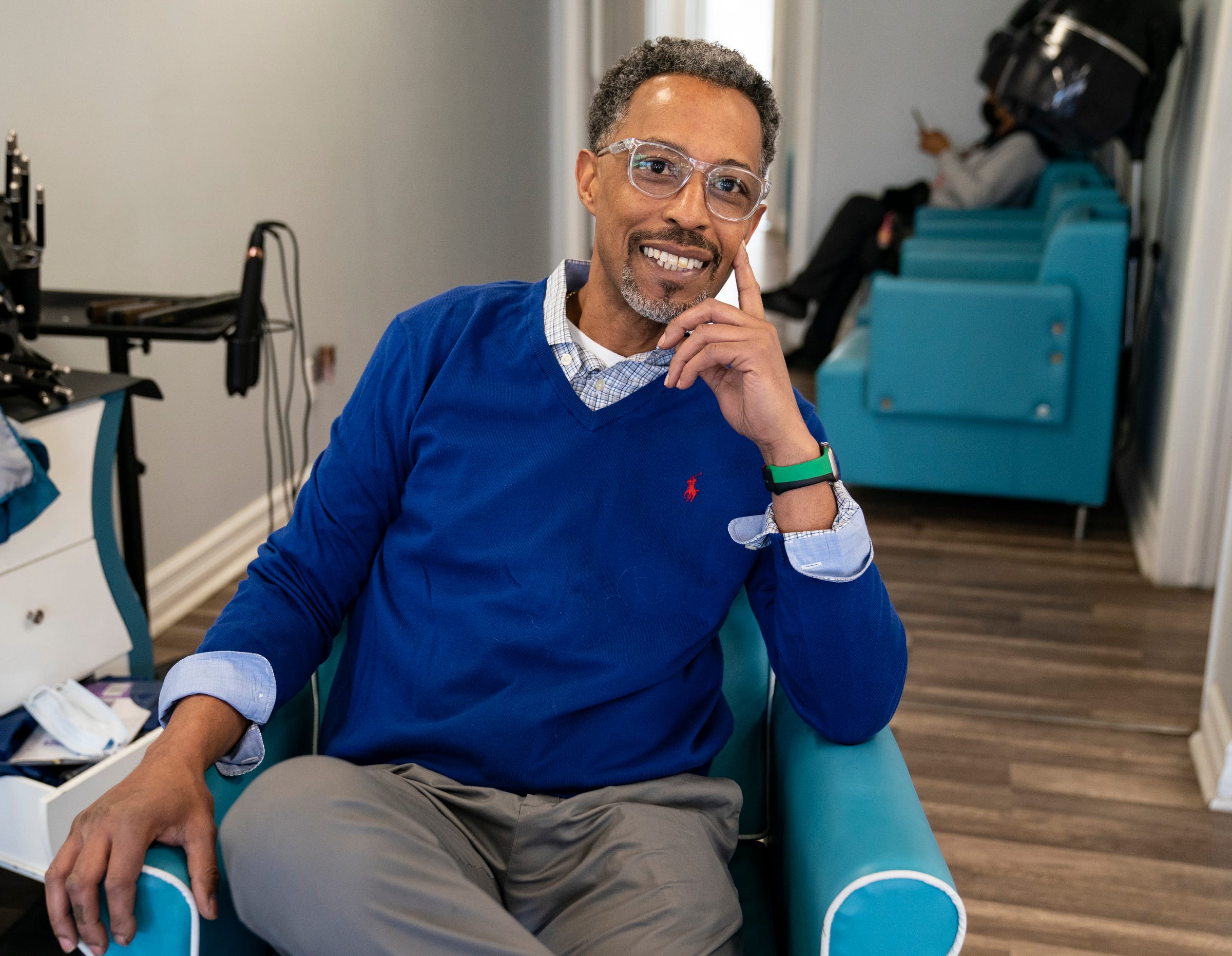 Steven Banks, a former hairdresser for Aretha Franklin, takes a moment to pose for a portrait at Salon Solei in Berkley on Tuesday, March 29, 2022. Banks also respects and celebrates Detroit's hair community, which is known worldwide, and his family, including his mother, were major players in that culture.