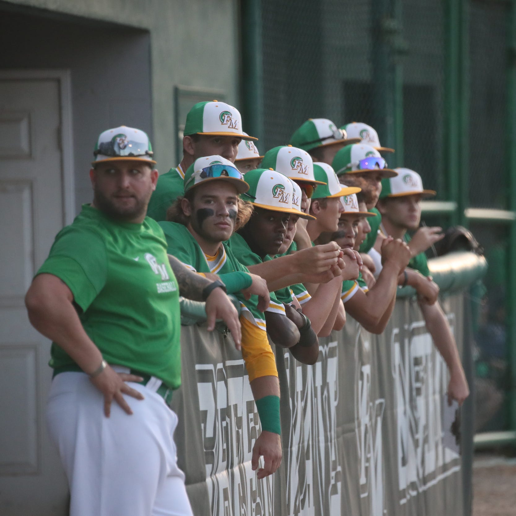 Fort Myers High assistant coach Alex Carcioppolo, who was removed from that post on Feb. 16 after sending a group message with a racial slur, and the Green Wave from a game agianst Naples High School on Wednesday, March 30, 2022.
