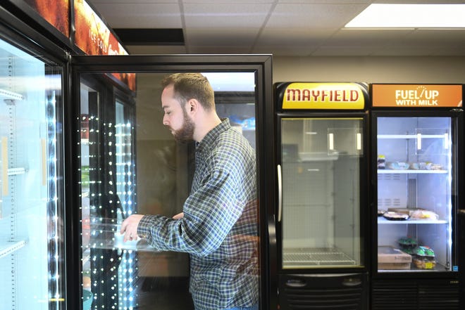 Evan Oliver, coordinator at Big Orange Pantry, organizes items available for pickup. The pantry, located at Grieve Hall, provides groceries and prepared meals for University of Tennessee students with food insecurity.