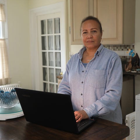 Sharon Churton searches for jobs on her computer w