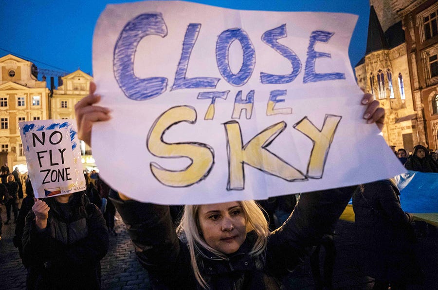 A protester holds a placard calling for a no-fly zone over Ukraine during a demonstration in Prague, Czech Republic, on March 15.