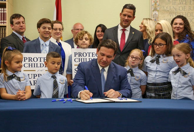 Florida Governor Ron DeSantis signs the Parents' Rights in Education Act on Monday, March 28, 2022 at Classical Preparatory School in Shady Hills, Florida.