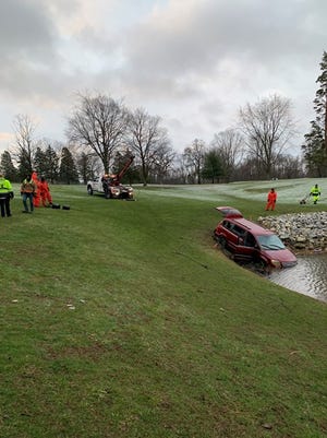 North Canton police and firefighters were joined by the South Summit County Dive Team and Stark County sheriff's deputies in a search Friday morning after a van was found submerged in a pond at Arrowhead Golf Club.