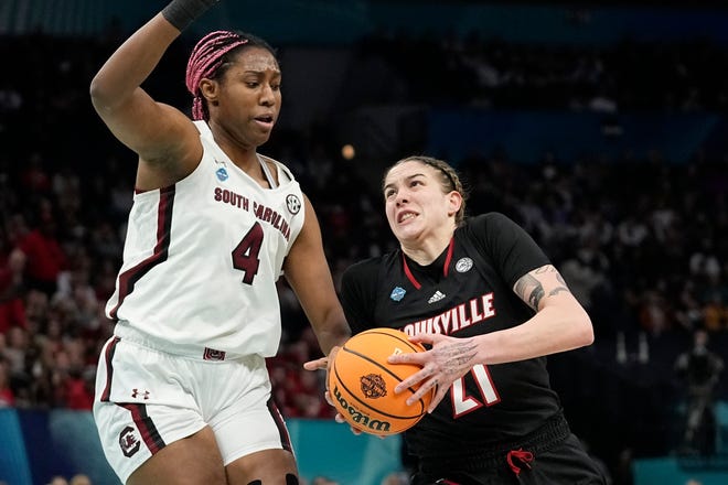 Louisville's Emily Engstler tries to get past South Carolina's Aliyah Boston during the first half of a college basketball game in the semifinal round of the Women's Final Four NCAA tournament Friday, April 1, 2022, in Minneapolis. (AP Photo/Eric Gay)