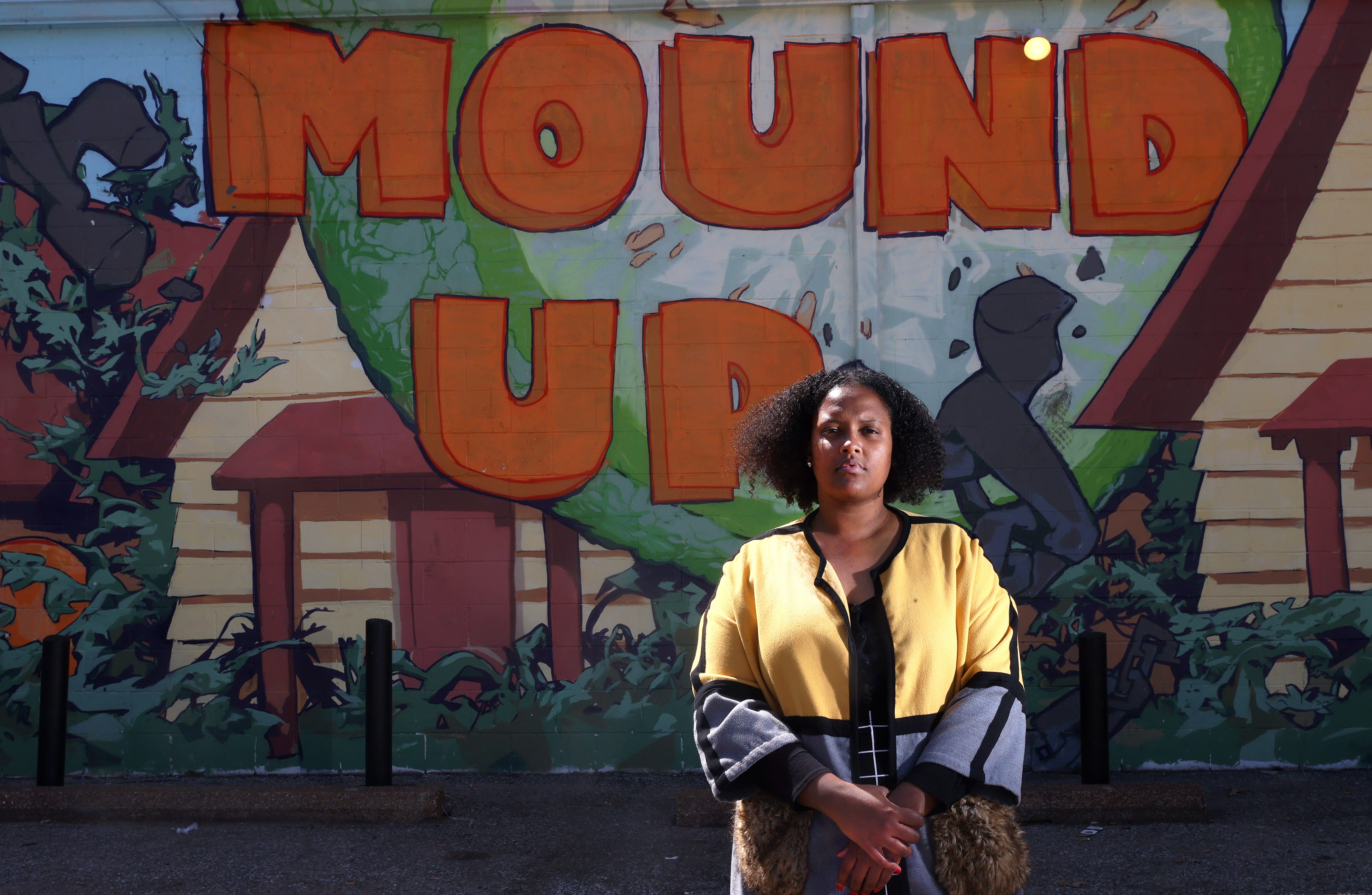 Britney Thornton, a K-8 grade teacher and founder of JUICE Orange Mound, stands outside of their neighborhood office.