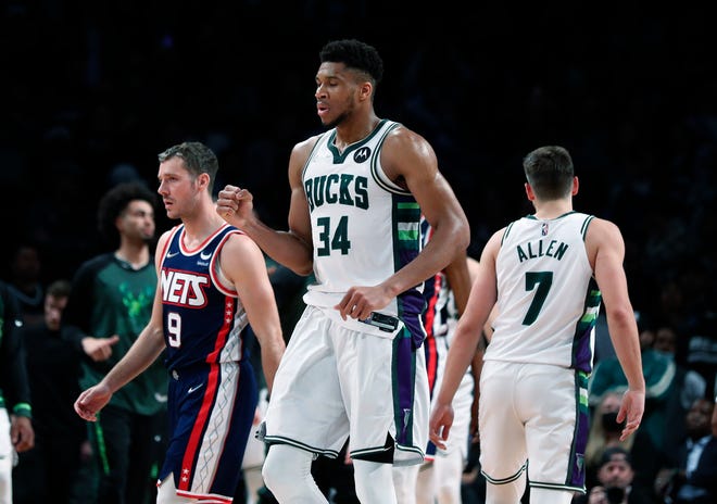 Bucks forward Giannis Antetokounmpo celebrates a basket Thursday night in a win over the Nets.  He finished with 44 points and edged Kareem Abdul-Jabbar atop the franchise's all-time scoring list with 14,216.