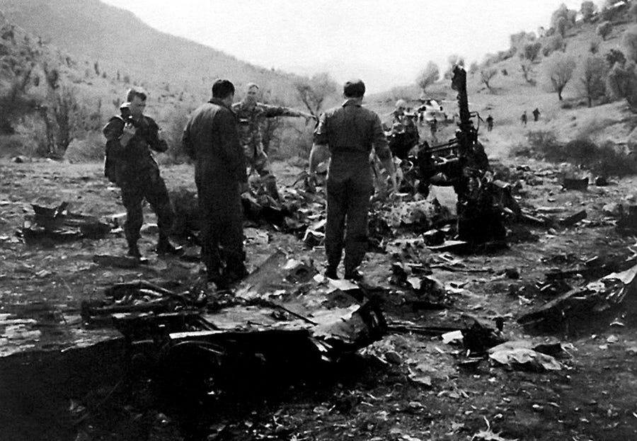 U.S. military personnel inspect the wreckage of one of two Black Hawk helicopters shot down by U.S. pilots in a no-fly zone in Northern Iraq in April 1994.