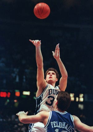 Duke'S Christian Laettner Shoots The Game-Winning Basket In Overtime Over Kentucky'S Deron Feldhaus Who Sent The Blue Devils To The 1992 Final Four.