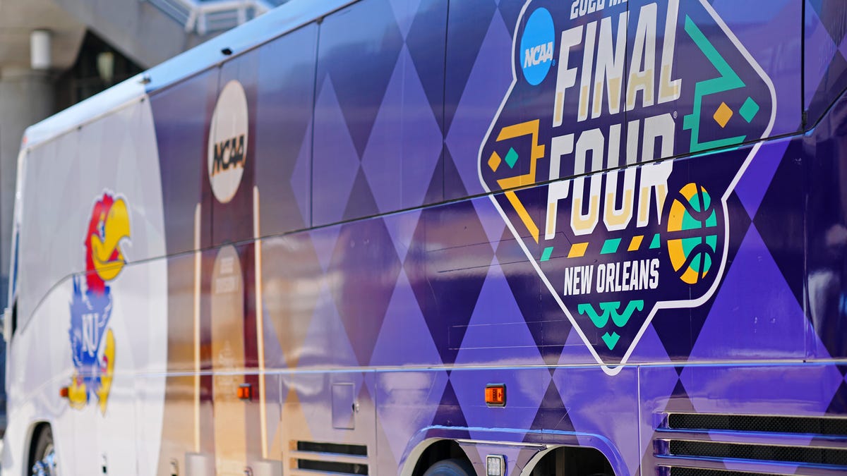 A detail view of the Kansas Jayhawks and NCAA branded bus wrap as the team arrives before the 2022 NCAA men's basketball tournament Final Four semifinals at Caesars Superdome. Mandatory Credit: Andrew Wevers-USA TODAY Sports