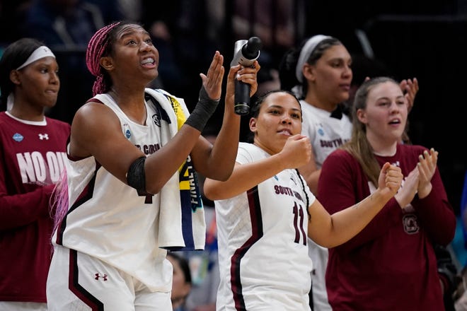 South Carolina's Aliyah Boston cheers from the bench in the final seconds of the second half of a college basketball game in the semifinal round of the Women's Final Four NCAA tournament Friday, April 1, 2022, in Minneapolis. (AP Photo/Charlie Neibergall)