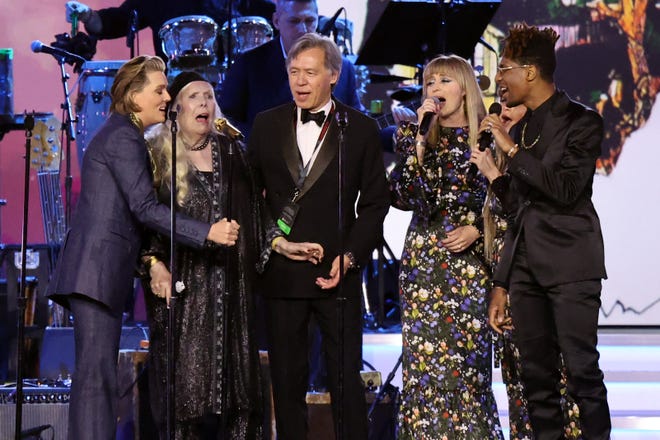 Brandi Carlile, Joni Mitchell, Holly Laessig, and Jon Batiste perform onstage during MusiCares Person of the Year honoring Joni Mitchell at MGM Grand Marquee Ballroom on April 01, 2022 in Las Vegas, Nevada.