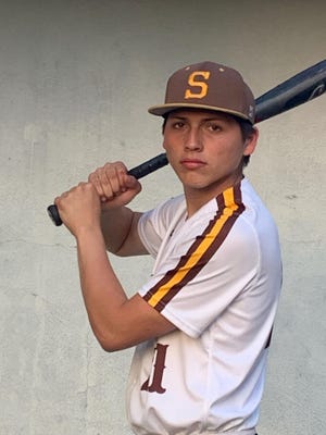 Stagg High School junior Angelo Guerrero poses for a photo in his baseball uniform and bat for a photo on April 1, 2022.