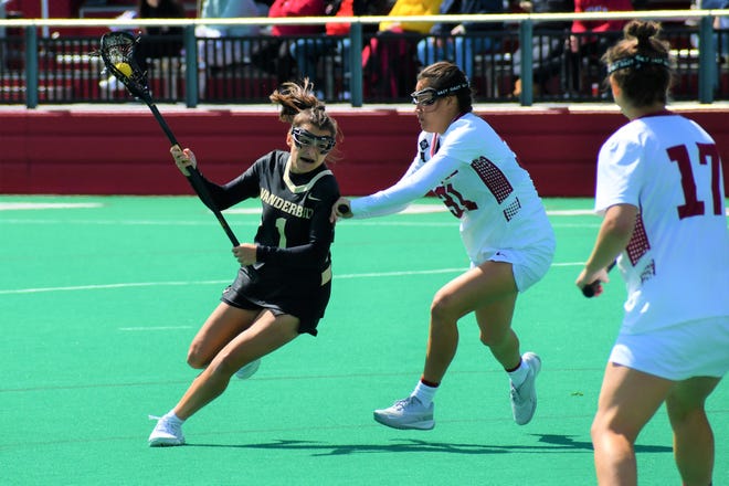 Vanderbilt attacker and Lenape High School graduate Gabby Fornia (1) drives to the goal against Temple defender Kessina Heyn as Moorestown grad Quinn Nicolai looks on. The NCAA awarded lacrosse players a fifth year of eligibility to make up for the 2020 season that was cut short by COVID-19.