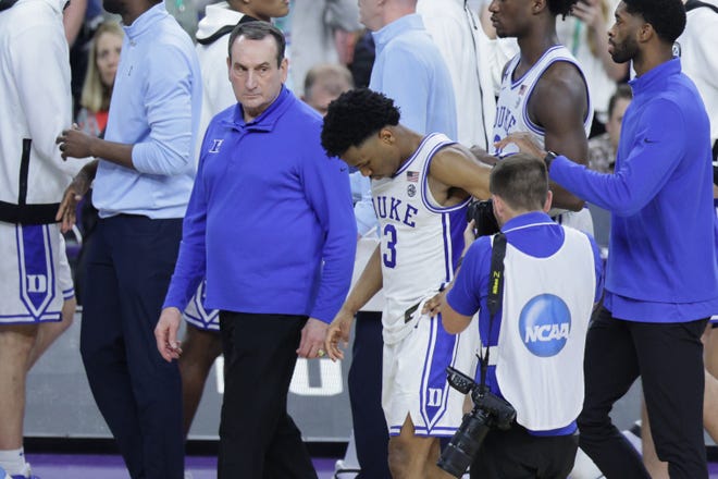 Mike Krzyzewski leaves the court after Saturday's loss to UNC.