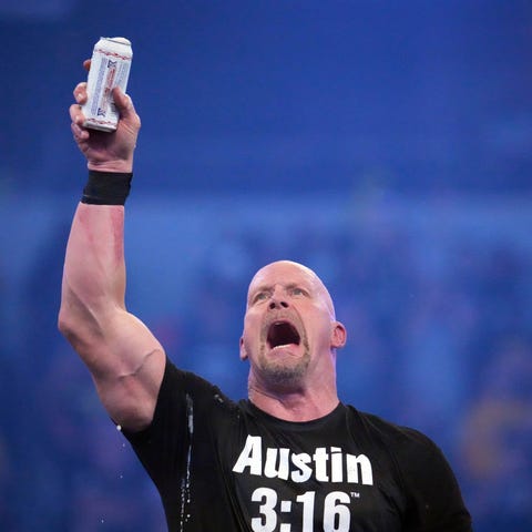 Stone Cold Steve Austin celebrates with beer after