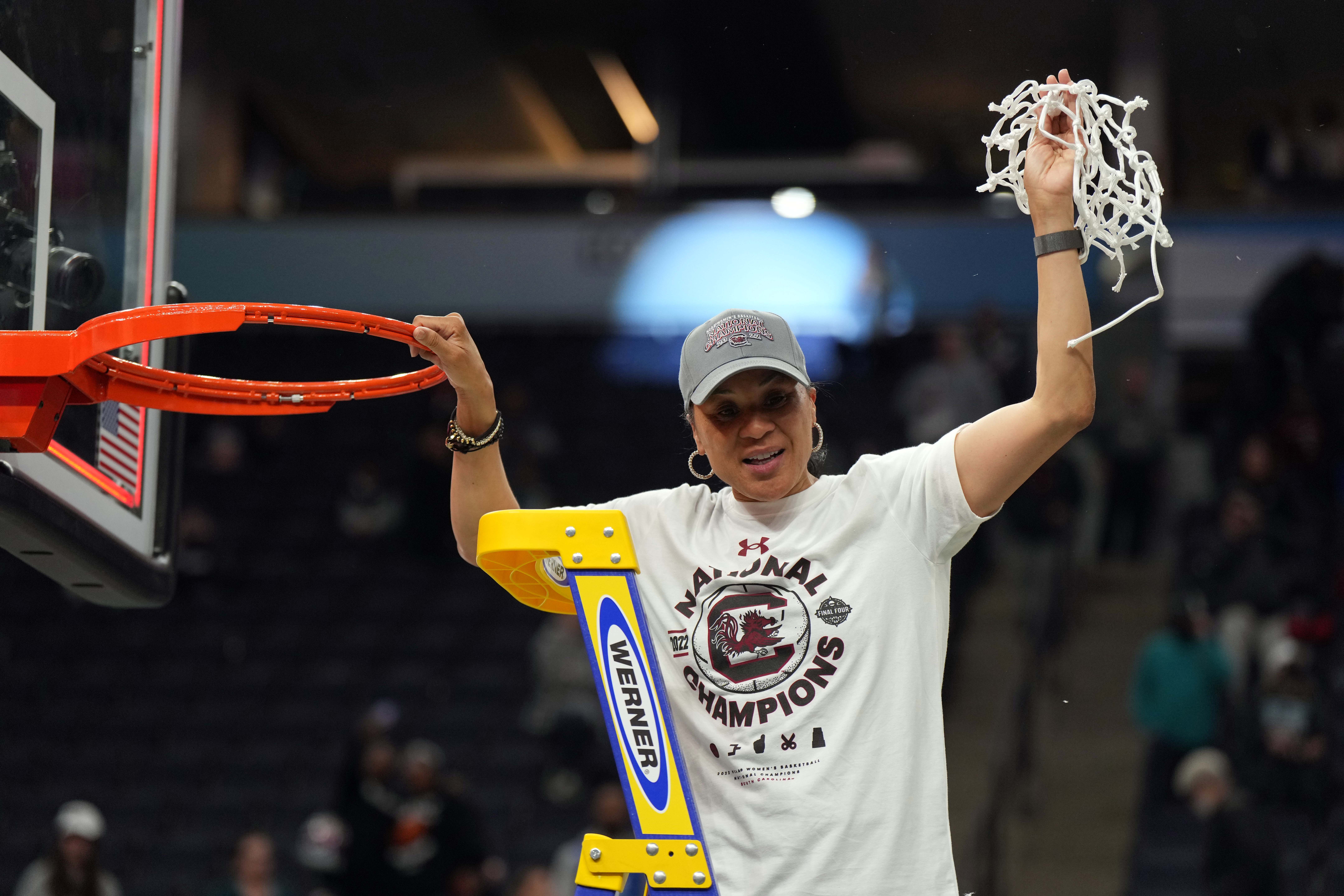 Apr 3, 2022; Minneapolis, MN, USA; South Carolina Gamecocks head coach Dawn Staley cuts down the net as they celebrate their 64-49 victory over the UConn Huskies in the Final Four championship game of the women's college basketball NCAA Tournament at Target Center.