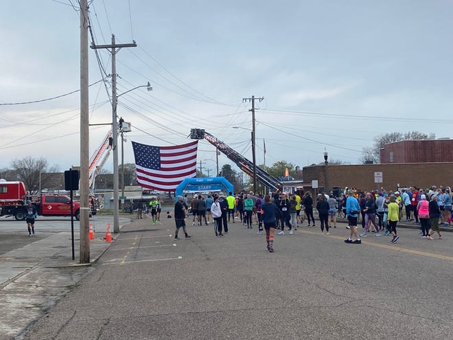 Runners line up a couple minutes before the 50th Andrew Jackson Marathon started in front of The Jackson Sun's offices on Lafayette Street in Downtown Jackson on Saturday.