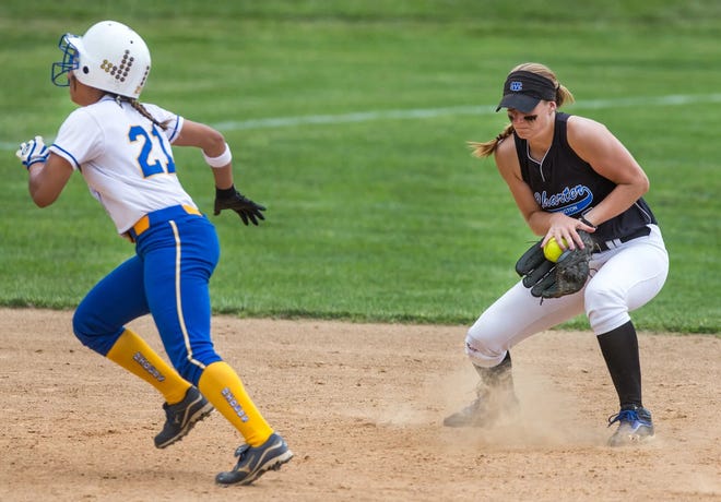 Caesar Rodney's Chaney Jones runs by Charter shortstop Jordan Schoenberger in a playoff game on May 24, 2014.