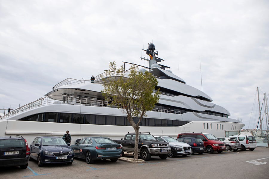 A Civil Guard stands by the yacht called Tango in Palma de Mallorca, Spain, Monday April 4, 2022. U.S. federal agents and Spain's Civil Guard are searching the yacht owned by a Russian oligarch. The yacht is among the assets linked to Viktor Vekselberg, a billionaire and close ally with Russia's President Vladimir Putin, who heads the Moscow-based Renova Group, a conglomerate encompassing metals, mining, tech and other assets, according to U.S. Treasury Department documents. All of Vekselberg's assets   in the U.S. are frozen and U.S. companies are forbidden from doing business with him and his entities. (AP Photo/Francisco Ubilla) ORG XMIT: PW106