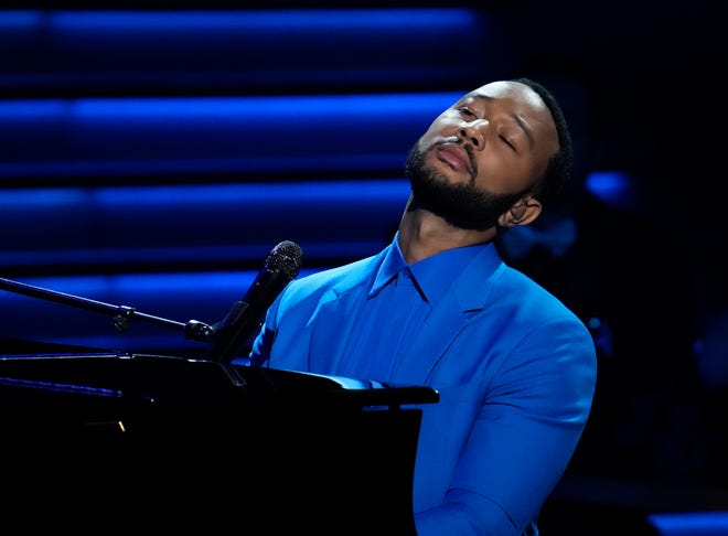 John Legend performs “Free” during a tribute to Ukraine at the 64th Grammy Awards.