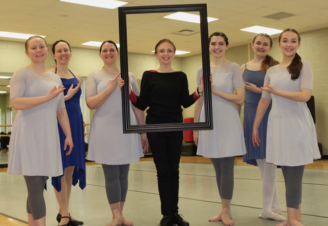 Director Kellie Lajiness (center) stands with Monroe County Community College’s Inside Out Dance Ensemble company members (from left) Elisabeth Brockman, Kelli Plumb, Autumn Hensley, Ashley Redfern, junior company member Maysie Burns and Claire Bacarella last April before the annual recital, “Access.” Lajiness is auditioning new members for the company Jan. 20-21.