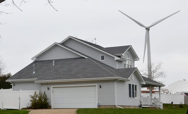 A group of residents in Portsmouth filed a lawsuit against the town and the company that operates a wind turbine, saying the turbine causes a public and private nuisance.