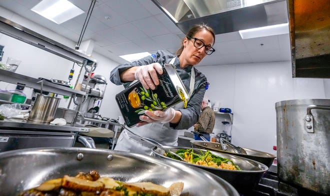 Chef Stephanie Duquette prepares a salmon dish for lunch. “When I saw this job advertised," she says, "I saw it as an opportunity to bring fresh local, nutritious, healthy, culturally diverse food to a population that's often forgotten in [addressing] food insecurity.”