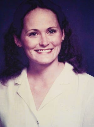 A photo of victim Jeanne Gilbert is shown during a press conference announcing that a suspect in the "Days Inn" cold case murders has been identified on Tuesday, April 5, 2022. The suspect, Harry Edward Greenwell, who died in 2013, was identified through investigative genealogy.