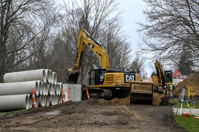A crew works on the Daniels Drain project on Northview Drive on Friday, April 1, 2022, in Meridian Township.
