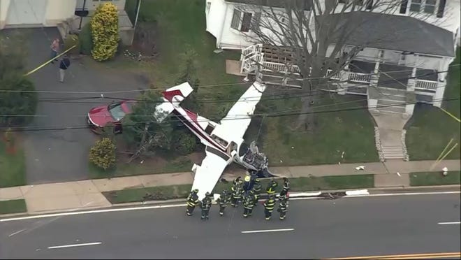 Authorities say a small plane crashed in the front yard of a home in Manville, N.J., leaving one person aboard the aircraft injured on April 4.
