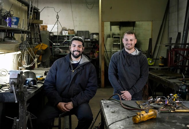 Eric Velazquez, left, and Jason Glaser of Jay's MetalCrafting were invited to participate in the "Emerging Artist" program at this year's Columbus Art Festival, and hope to boost the artistry side of the Whitehall business along with the city's arts scene.
