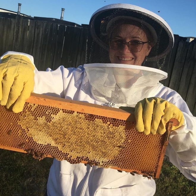 Jessica Reeves suits up to handle her bees.