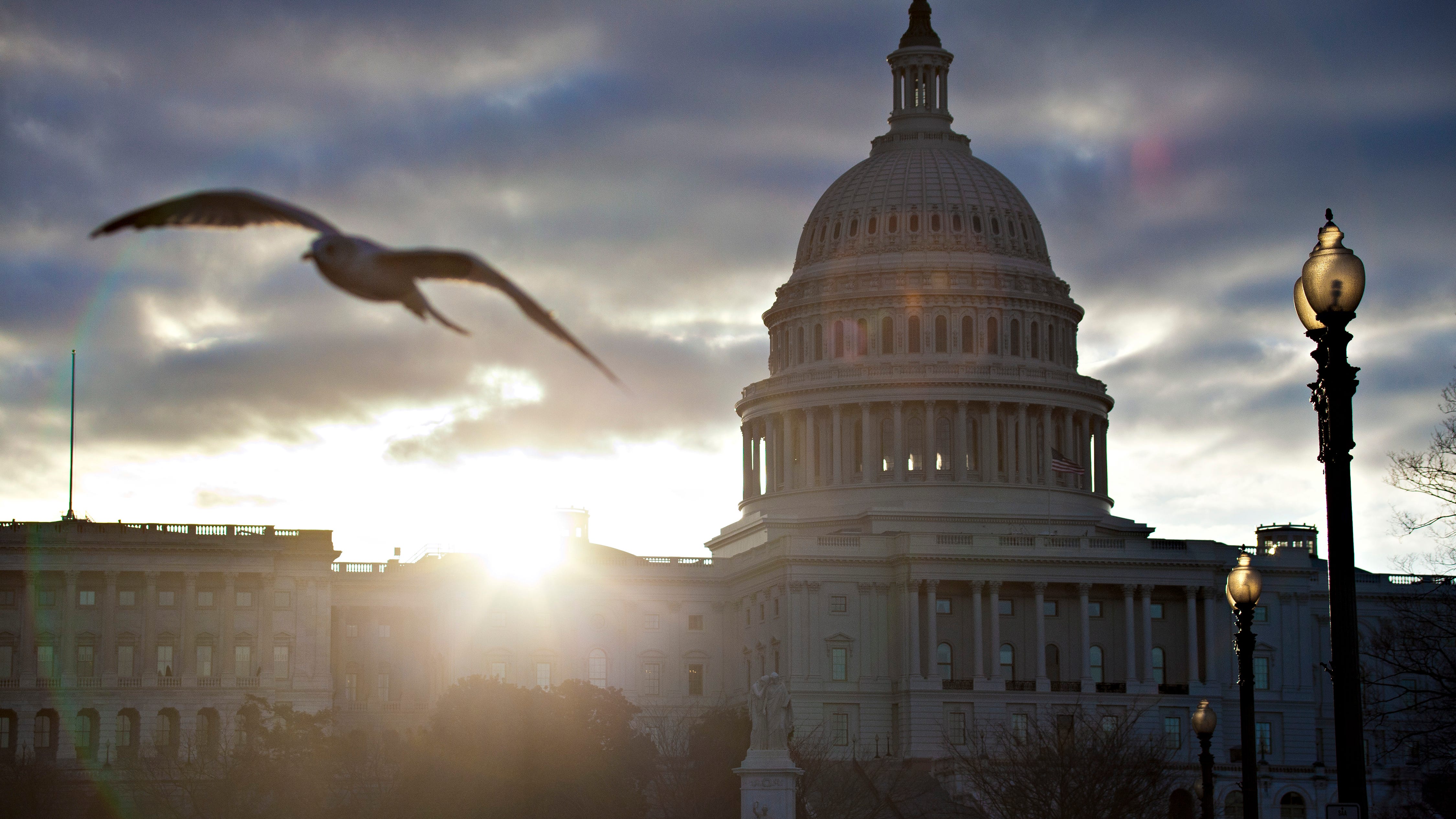 FILE – In this March 7, 2013, file photo the sun breaks through clouds over the U.S. Capitol in Washington in 2013. Daylight-saving time begins at 2 a.m. Sunday, when clocks officially move ahead an hour. (AP Photo/J. Scott Applewhite, File)