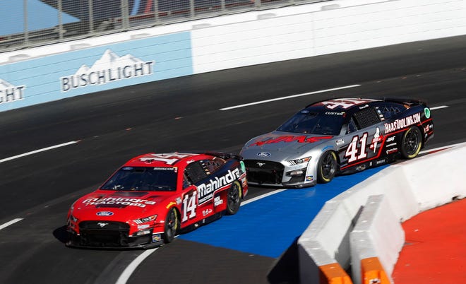 Mitchell's Chase Briscoe (14) leads SHR teammate Cole Custer during the season-opening short-track race in Los Angeles.