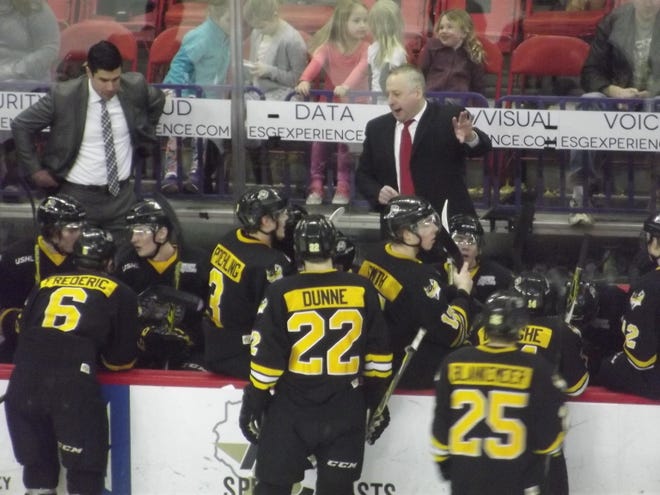 Green Bay Gamblers coach Pat Mikesch, right, talks to his team during a timeout in 2016.