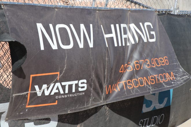 A 'now hiring sign' like this Watts Construction sign, is a common sight in Washington County as the county currently has 2.3% unemployment rate. April 5, 2022.