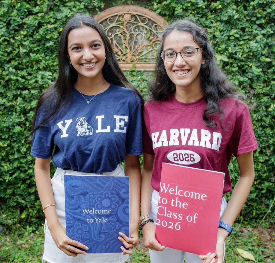 Twin sisters and co-valedictorians at Chiles High School, Surabhi Kumar, who will be attending Yale, and Sandhya, who will be attending Harvard, pose for a photo together Tuesday, April 5, 2022.