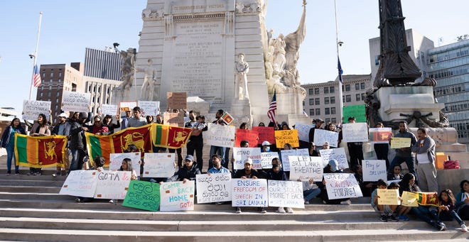 Sri Lankan Americans gather on April 3, 2022, next to the Circle of Monuments in Indianapolis to demonstrate solidarity with Sri Lankans suffering an unprecedented economic crisis.