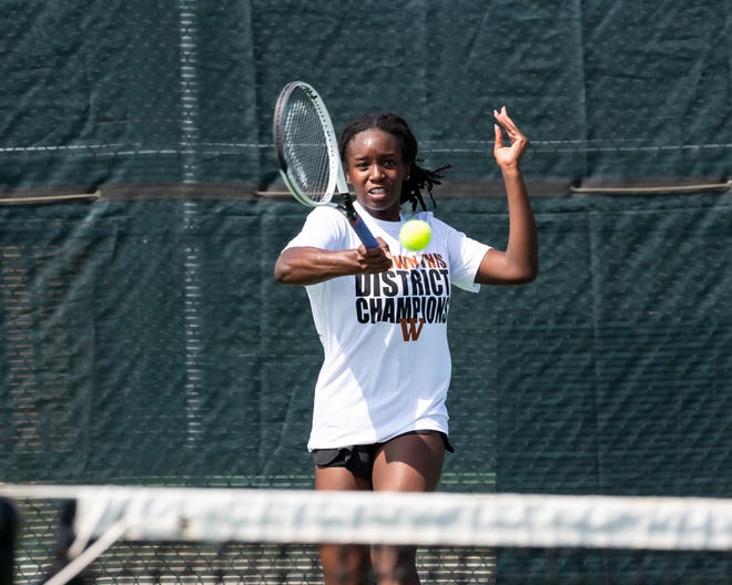 Kinaa Graham makes a return for Westwood on her way to the girls singles title at the District 25-6A tennis tournament , which was played at Old Settlers Park on April 4-5.