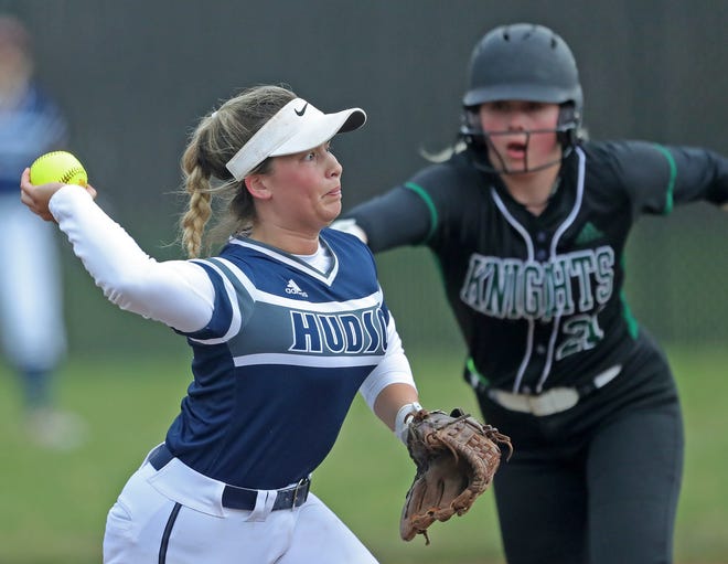 Hudson shortstop Katie Carrillo, left, makes the throw to first to force out Nordonia batter Larken Koran during the second inning of a softball game in Macedonia on Wednesday.