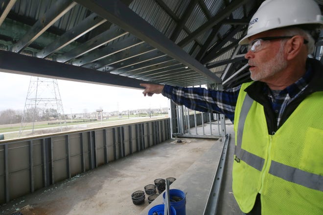 Marker Construction senior superintendent Keith Bayliss points out the upstairs patio area April 1 at the new Powell/Liberty branch of the Delaware County District Library under construction at Home and Steitz roads and is expected to be opened this fall.