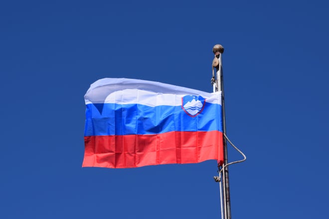 The Slovenian flag blows in the wind above Sister Cities Plaza in Pueblo on Thursday.
