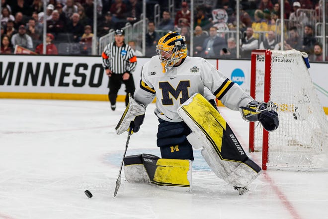 Michigan goalkeeper Erik Portillo looks set to pass against Denver in the second period of the Frozen Four semifinal at TD Garden in Boston on Thursday, April 7, 2022.