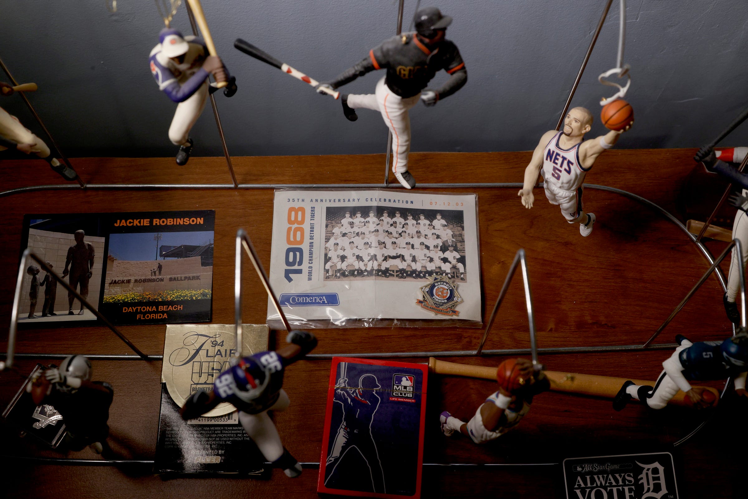 A postcard of the 35th-anniversary celebration of the 1968 World Series-winning Detroit Tigers. One of many Tigers memorabilia that Mike "Tiger" Price has in the basement of his Detroit home on April 6, 2022. Price is a Tigers super fan.