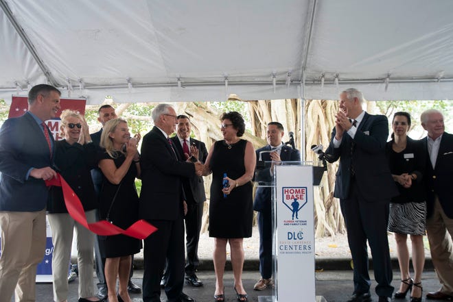 Florida Senator Kathleen Passidomo, center, reacts after cutting the ribbon during a ceremony announcing a partnership between Home Base Florida and David Lawrence Centers, Thursday, April 7, 2022, at David Lawrence Centers in Naples, Fla.
The new outpatient mental health services are for veterans, service members and military families impacted by the invisible wounds of war.
