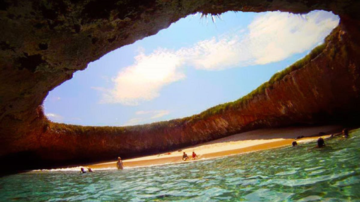Playa Del Amor, with its open dome hole is known as Hidden Beach and is located on the uninhabited Marieta Islands off the coast of Punta Mita in the Riviera Nayarit.
