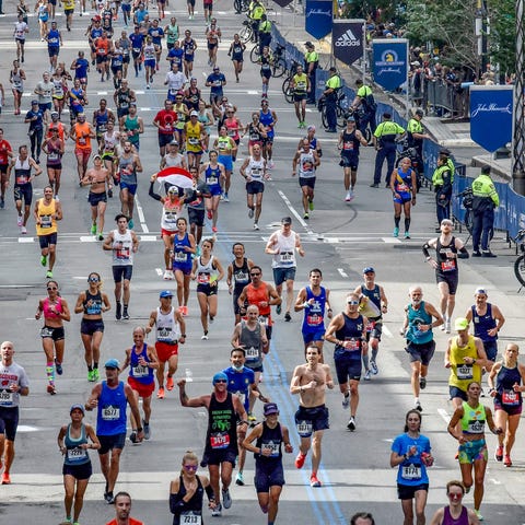 Runners run in the 2021 Boston Marathon.
